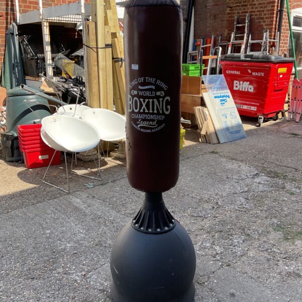 Gallant 5.5ft free standing boxing bag in a workshop setting.