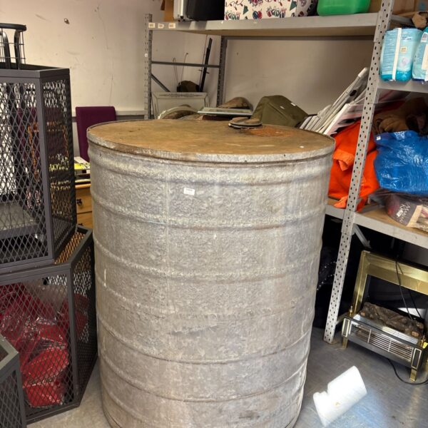 Large galvanised water tank, ideal for garden or outdoor storage.