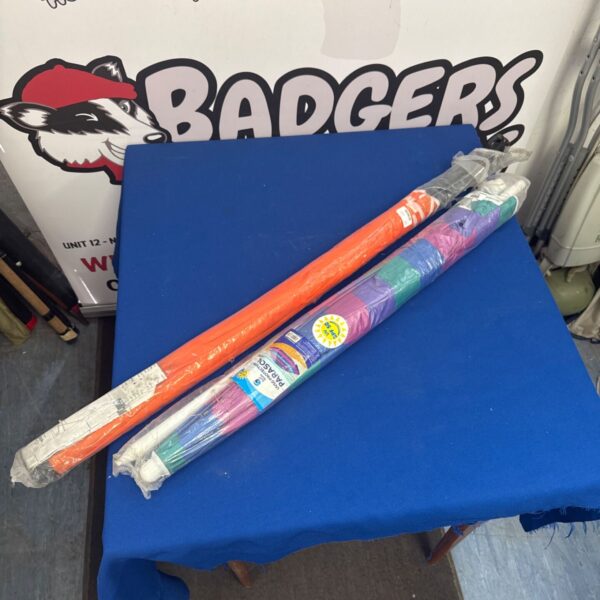 Two colourful striped garden parasols for outdoor shade.