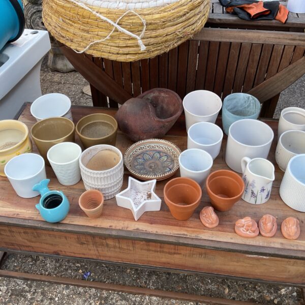 Mixed lot of colourful garden pots and flower pots for plants.