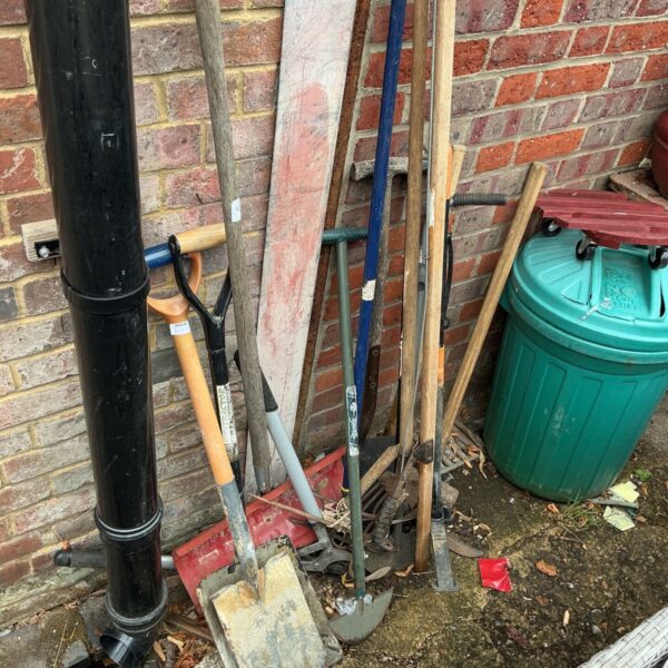 Job lot of used garden tools including spades and shovels.