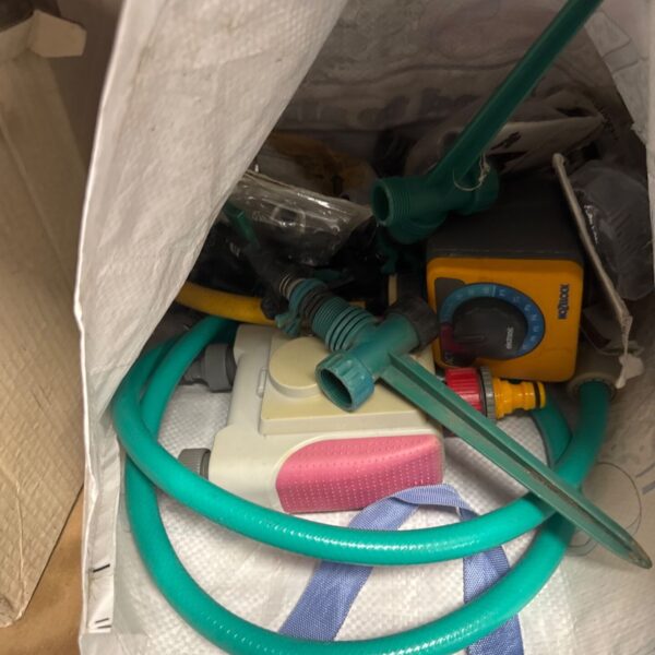 Garden watering set with Hozelock timer and green hosepipe.