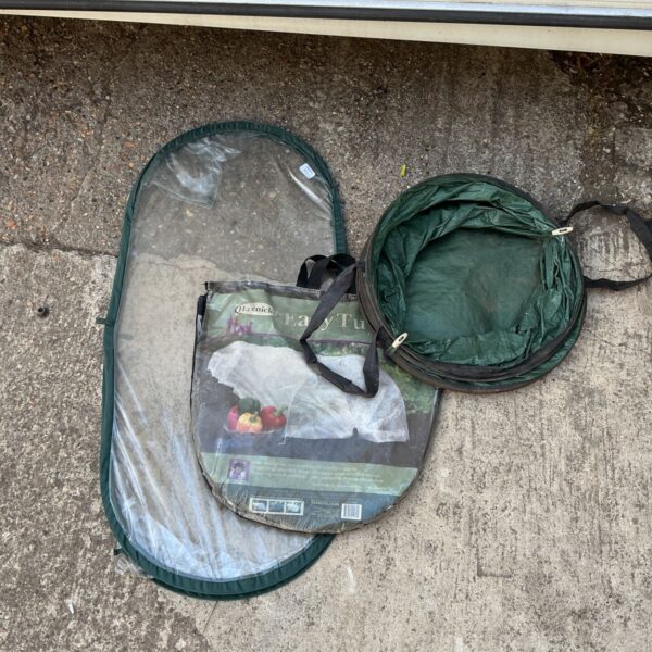 Lot of three green gardening bags for plants.
