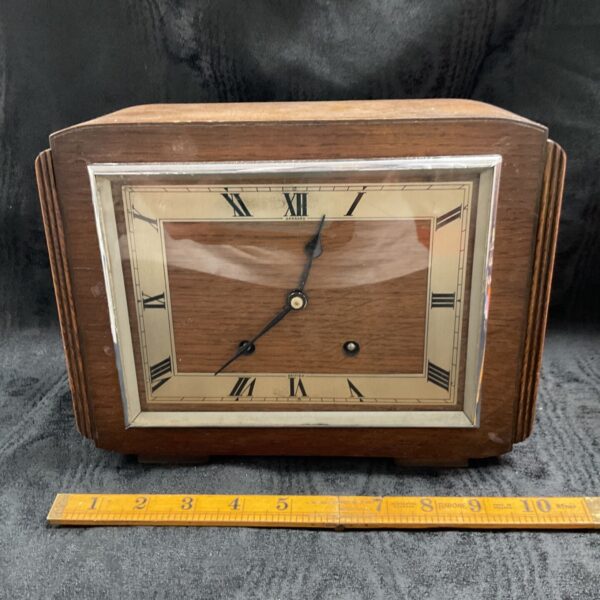 Vintage Garrard oak mantle clock with brass dial.