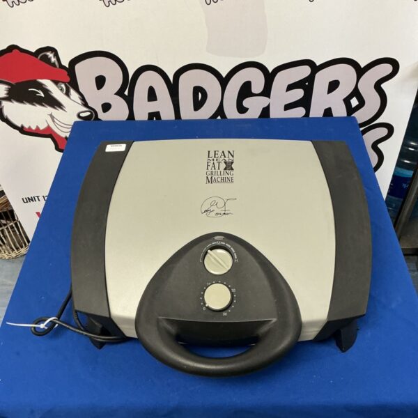George Foreman grill with control knobs and silver surface.