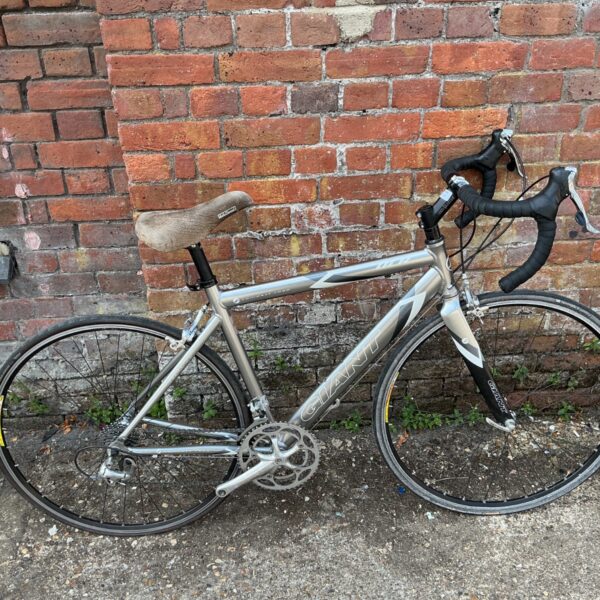 Silver and black Giant OCR Compact road bike, side view.