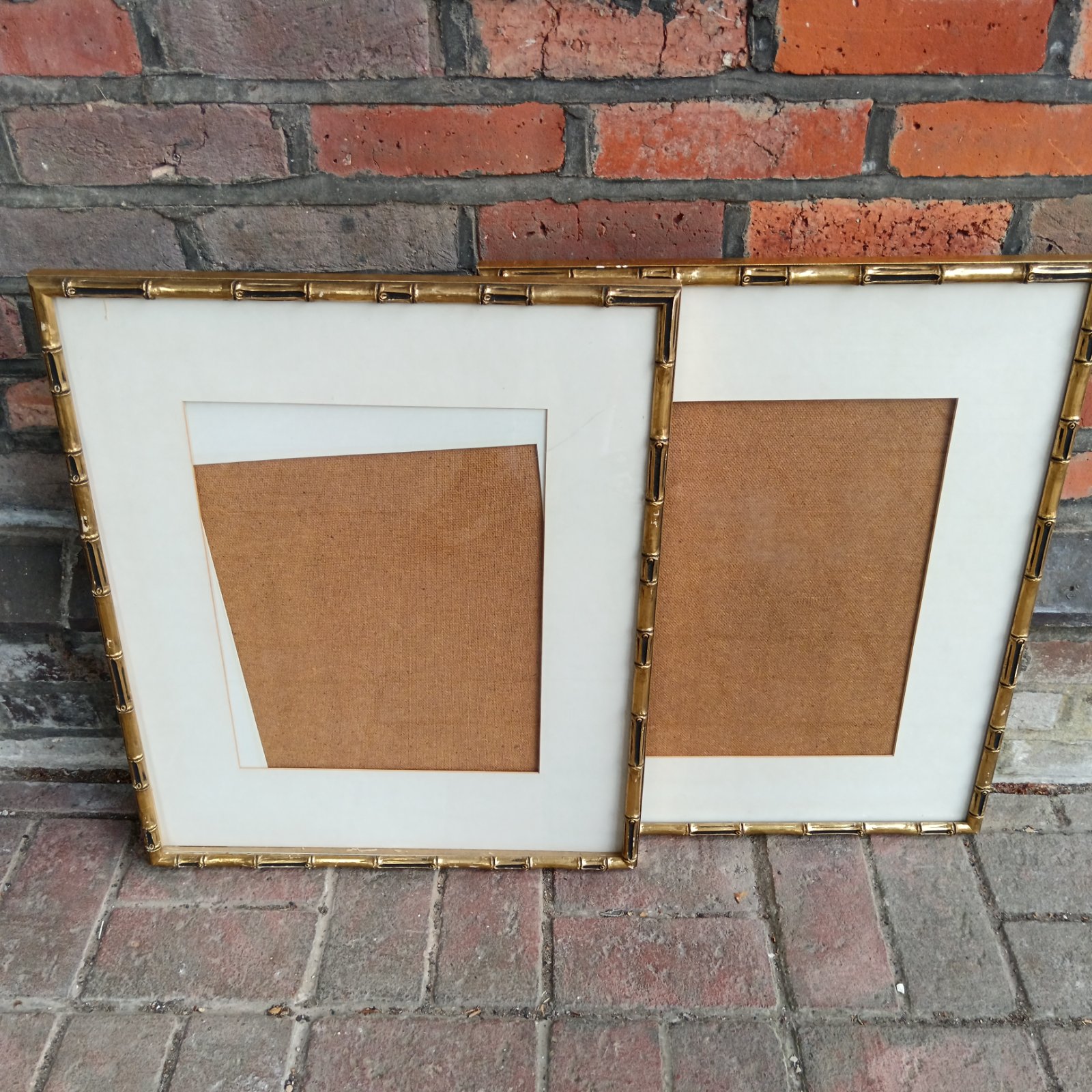 Pair of vintage gilt bamboo picture frames for wall decor.