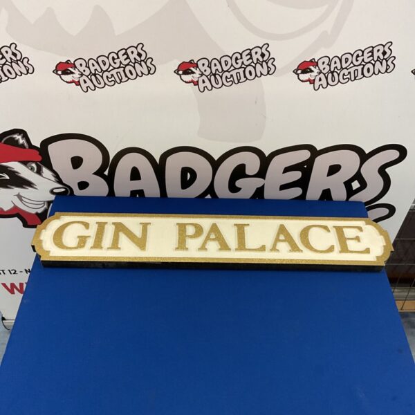 Gold glitter "Gin Palace" sign for vintage bar decor.