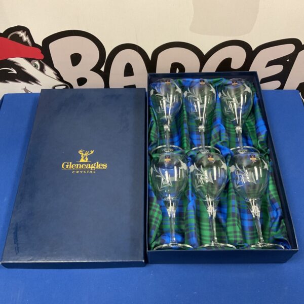 Set of six Gleneagles crystal wine glasses with thistle etching.