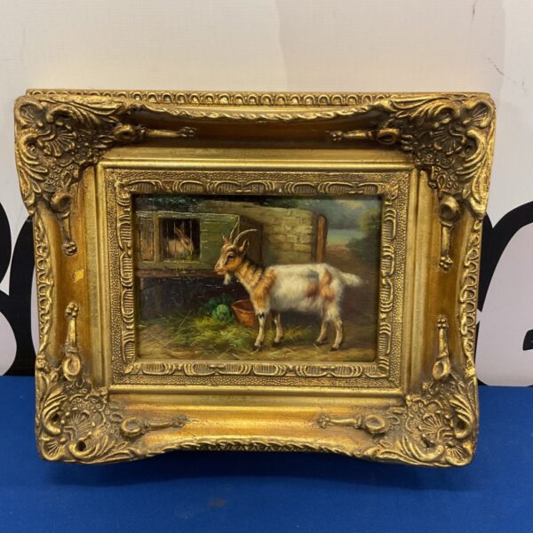 Antique oil painting of a goat and rabbit in a gilt frame.
