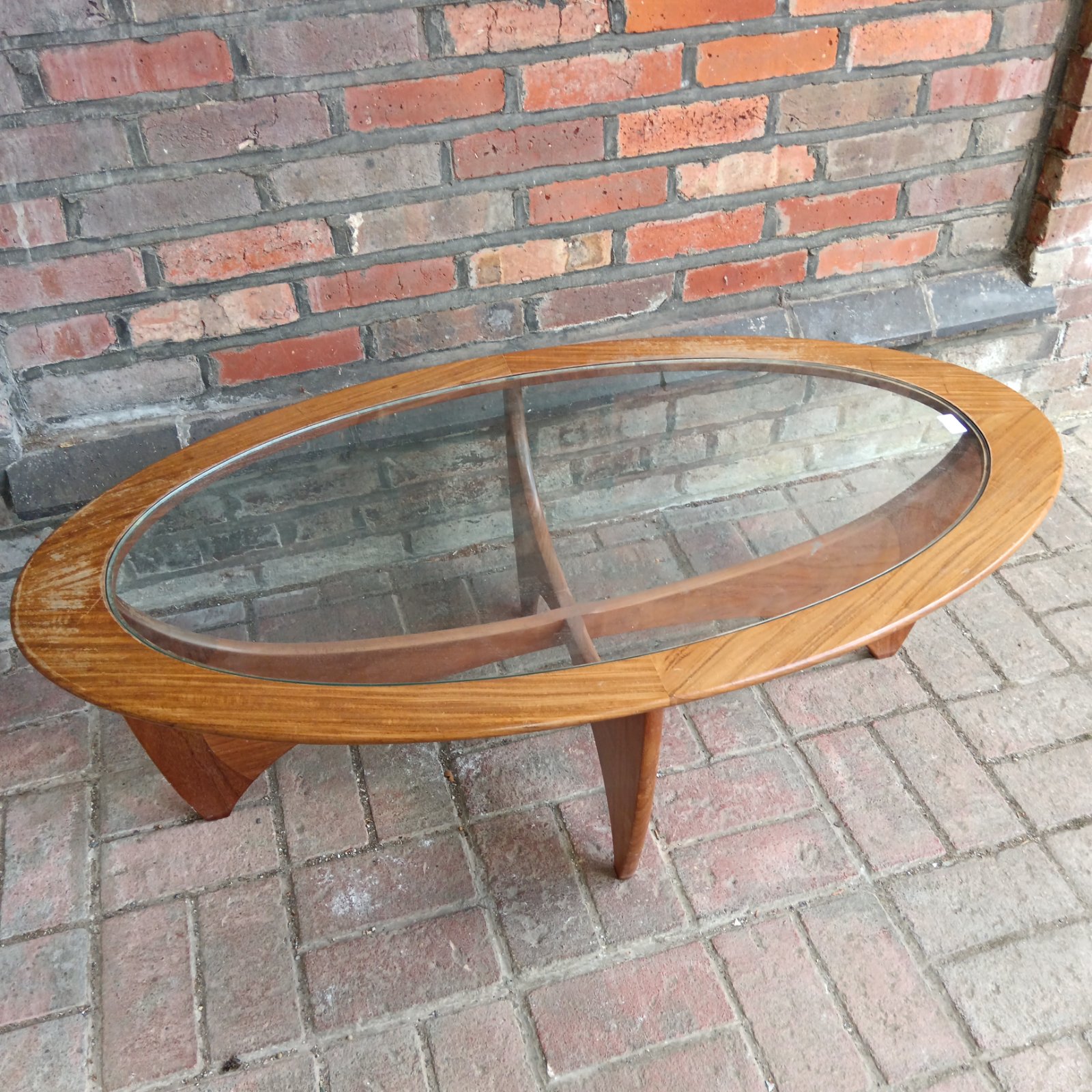 Vintage Gplan Astro coffee table with glass top and teak frame.