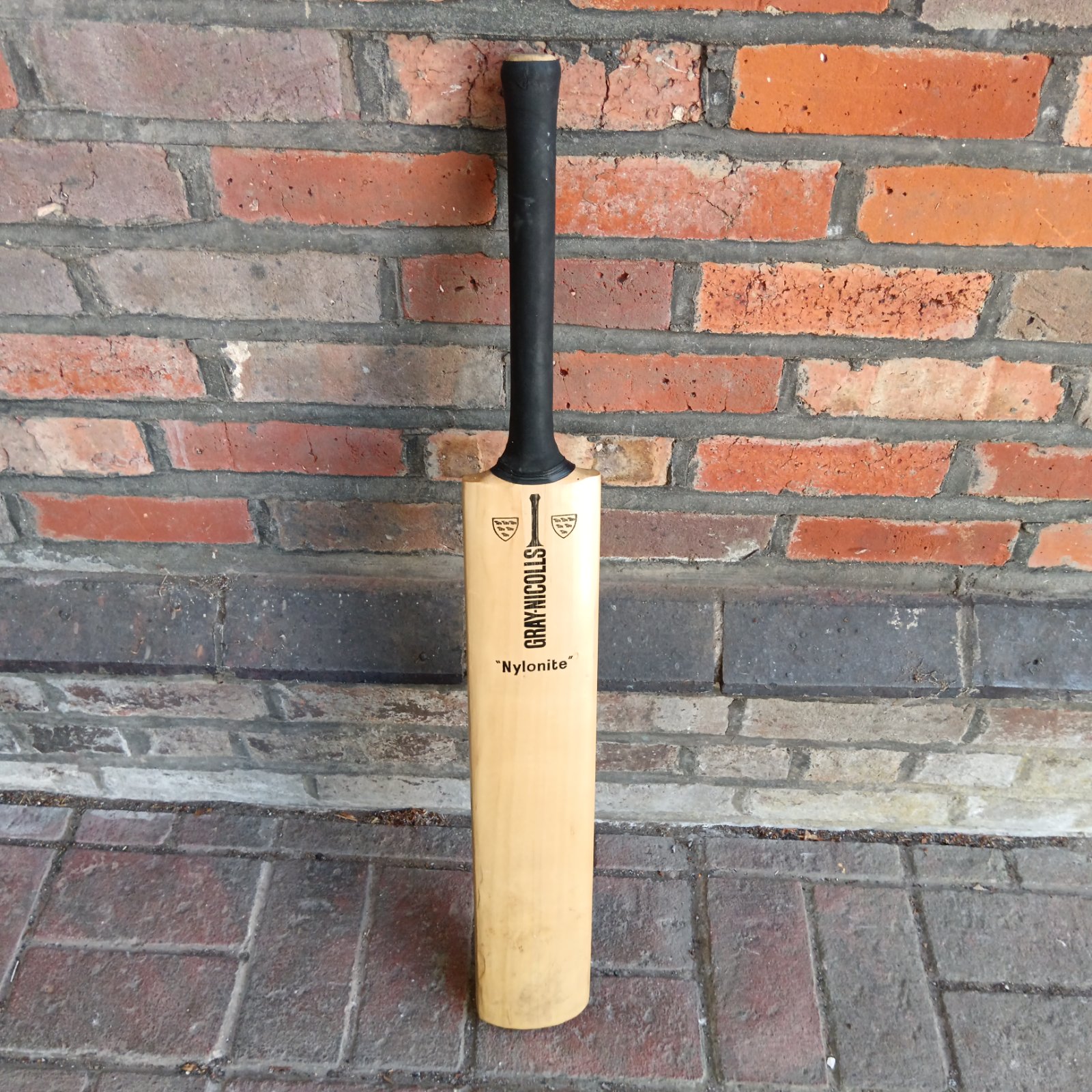 Vintage Gray Nicolls Nylonite cricket bat in good condition.