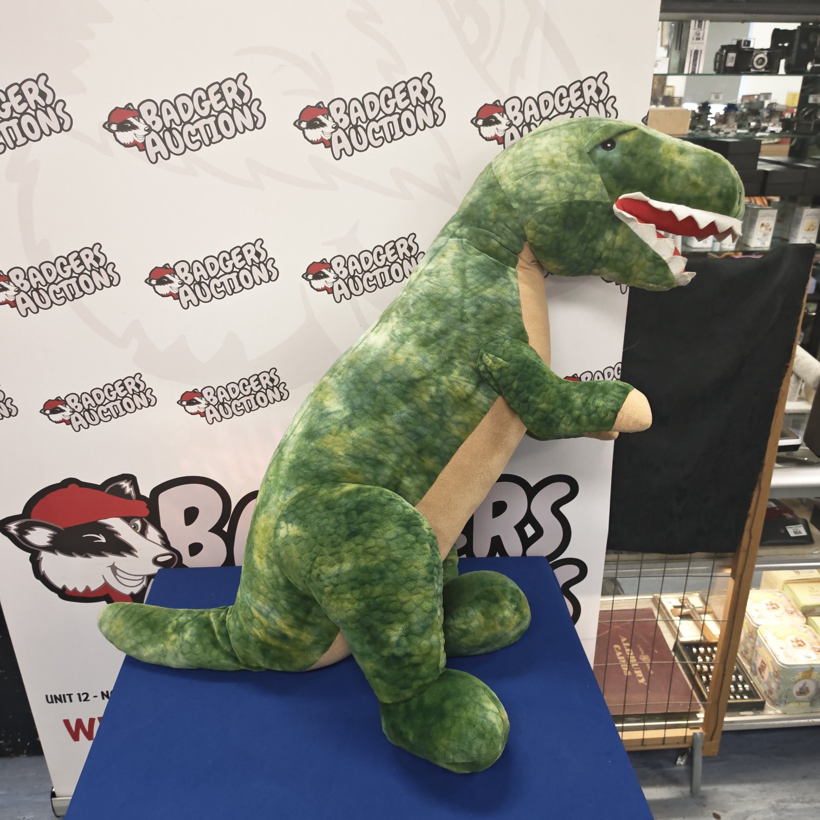 Large green dinosaur cuddly toy for children or collectors.