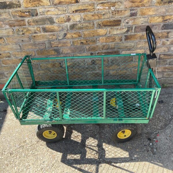 Green heavy-duty garden trolley with pneumatic tyres.