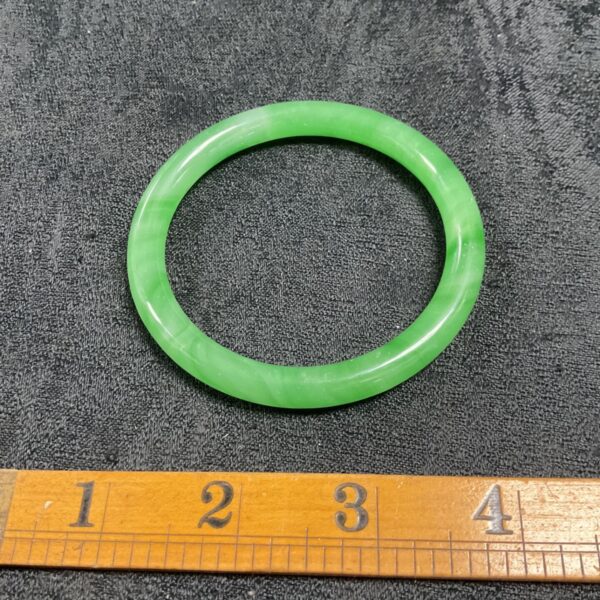 Smooth green jade bangle, a beautiful piece of Asian jewellery.