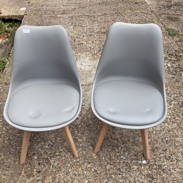 Grey MCC Eva dining chair with wooden legs.