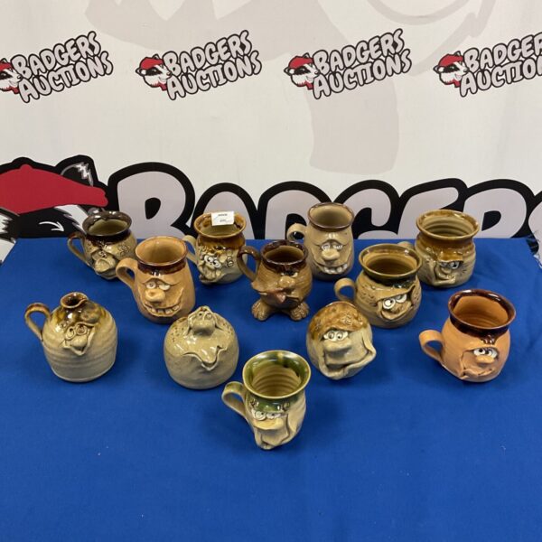 Collection of six vintage grotesque face mugs with unique designs.