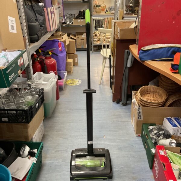 Gtech Airram K9 cordless vacuum cleaner in a home setting.