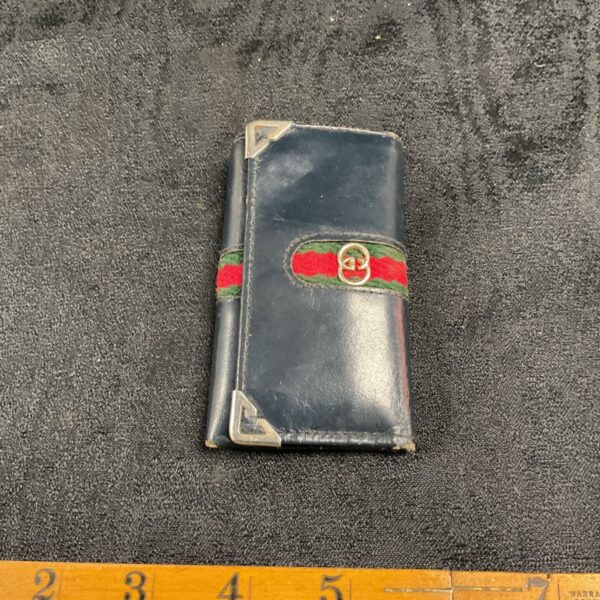 Vintage Gucci key wallet with green and red web stripe.
