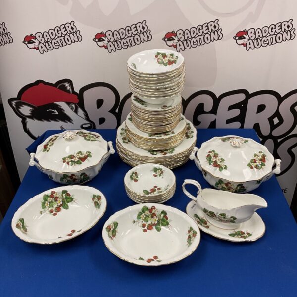 Large Hammersley strawberry pattern dinner service set on display.