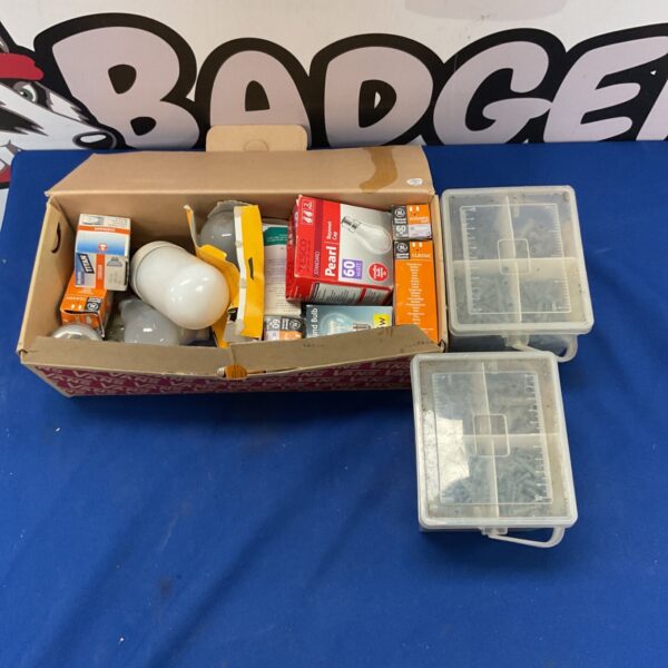 Mixed lot of vintage hardware, lightbulbs, and toolboxes.