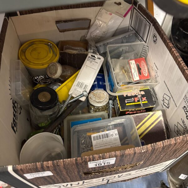 Box of assorted hardware including nails and screws.