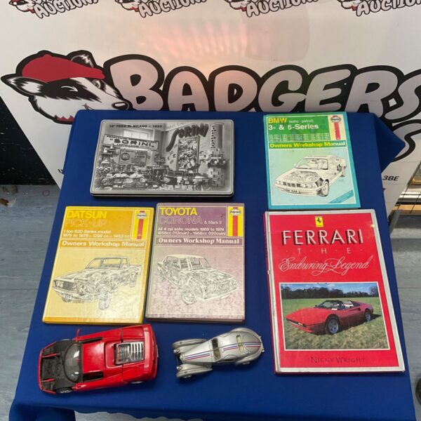 Vintage Haynes workshop manuals lot with tin and model cars.