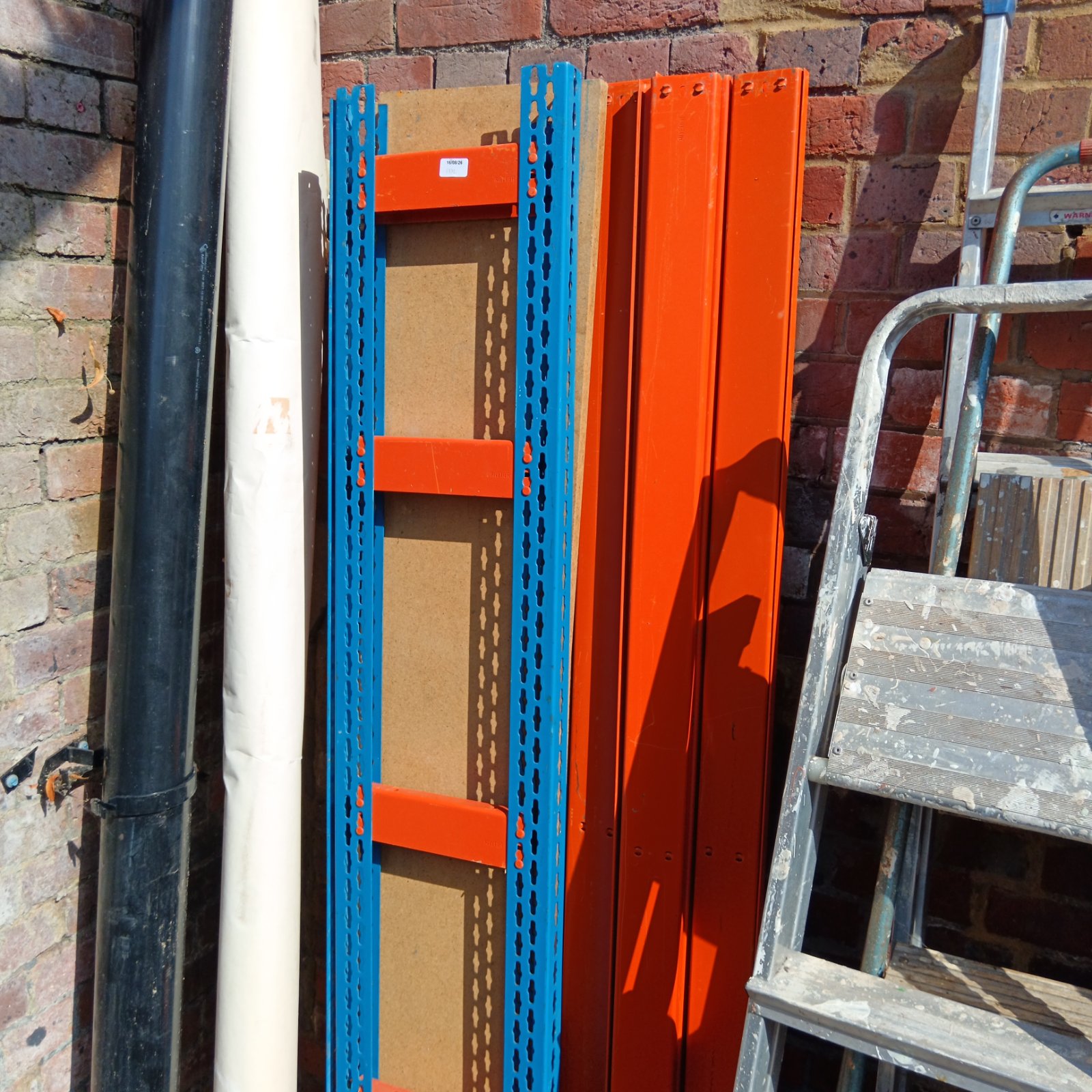 Orange and blue heavy duty racking for industrial storage.