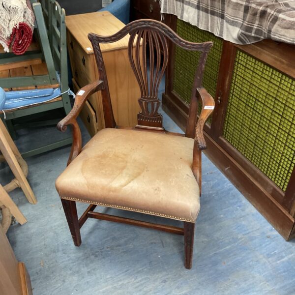 Antique mahogany Hepplewhite armchair with shield back detail.