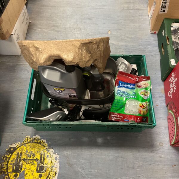 Crate of vintage home phones and pet supplies.