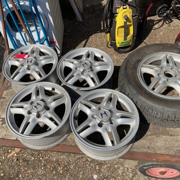 Set of five Honda CRV alloy wheels with tires.