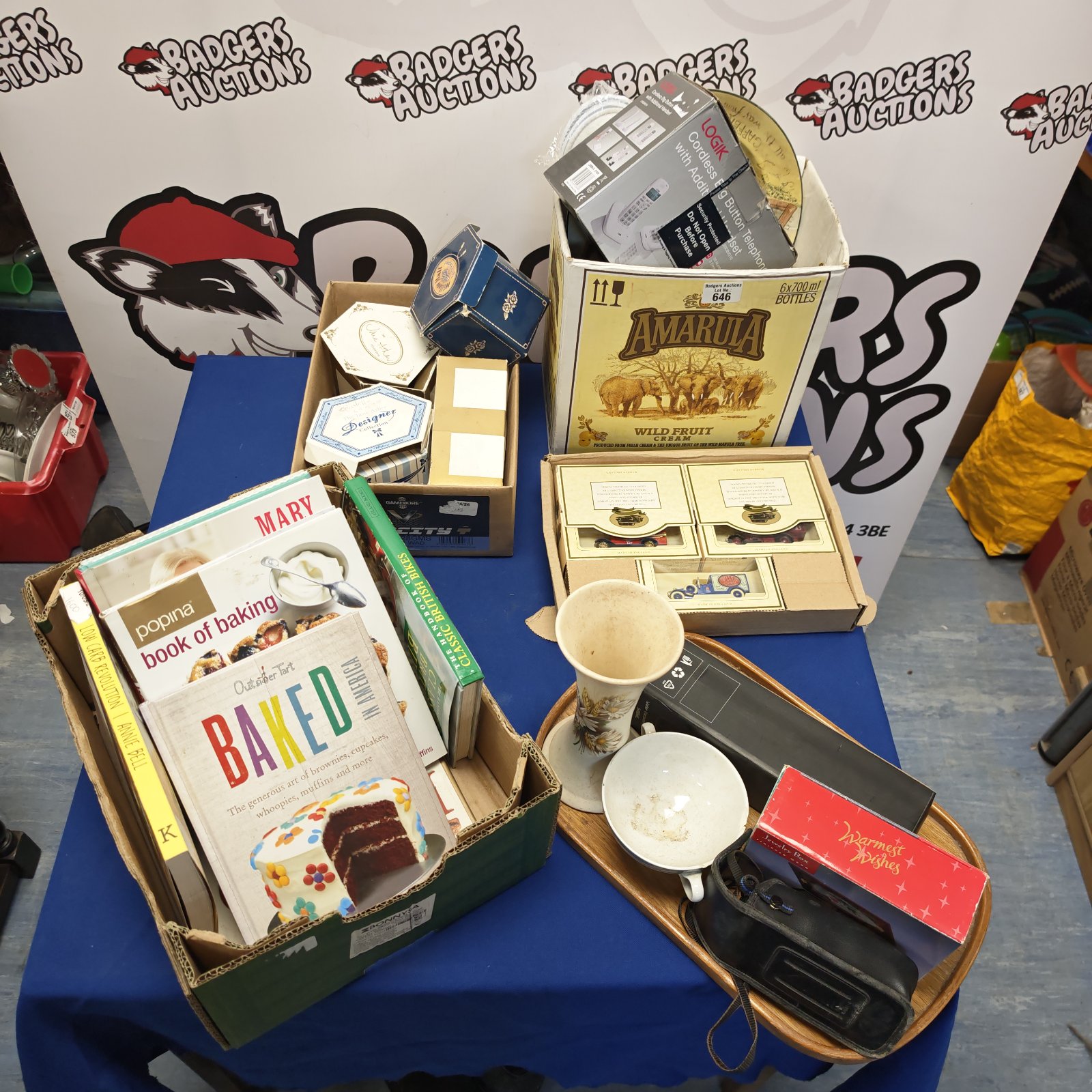 House clearance bundle featuring cookery books, a telephone, and diecast cars.