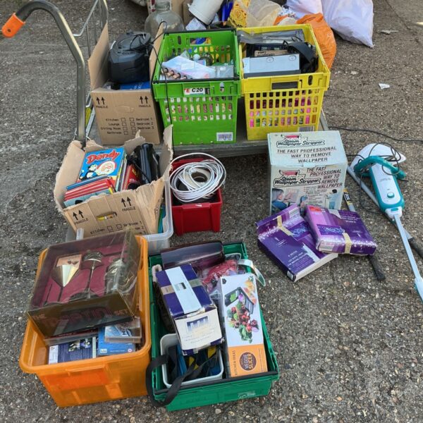 House clearance lot with CD player, wallpaper stripper, and books.