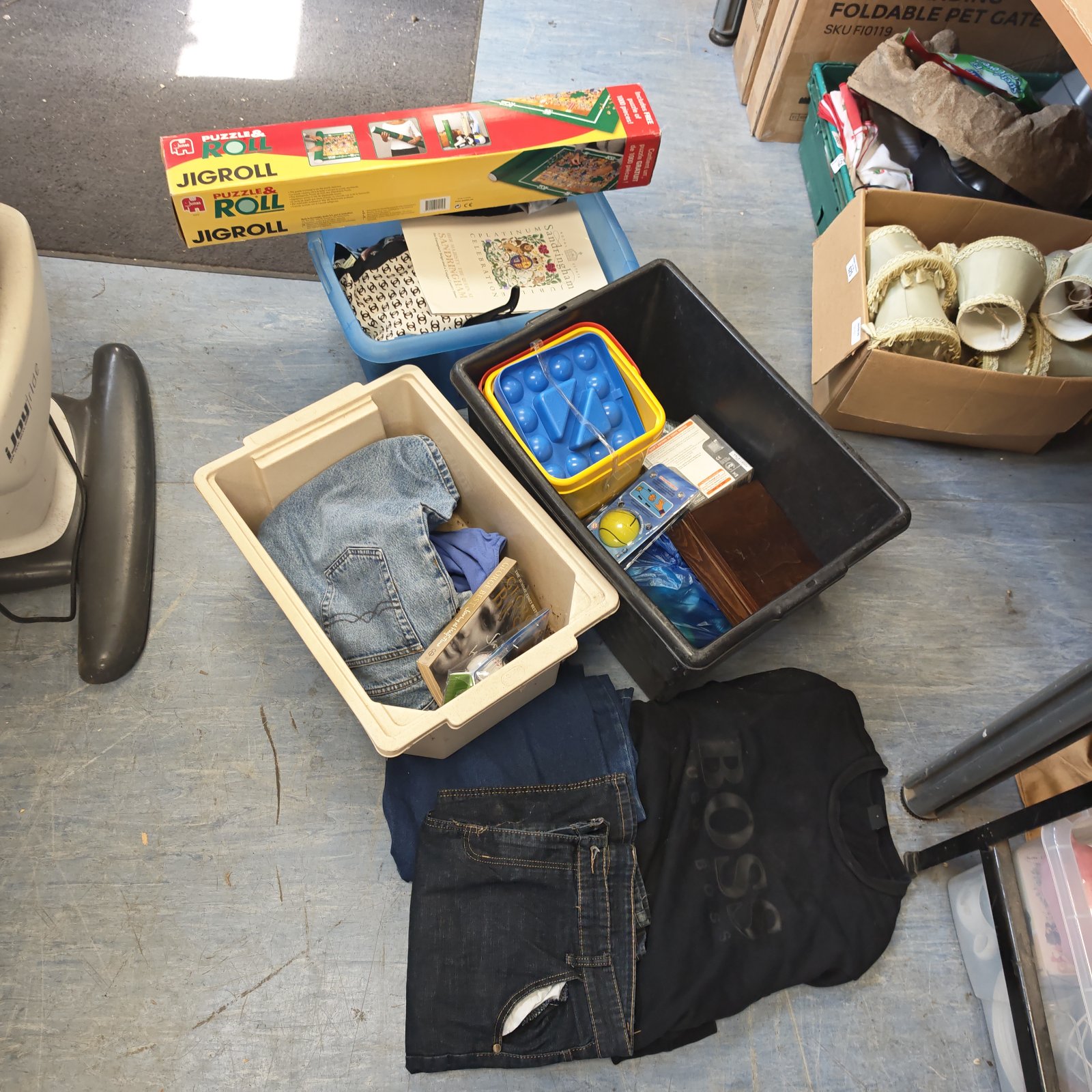 House clearance lot with jeans and a Boss jumper visible.