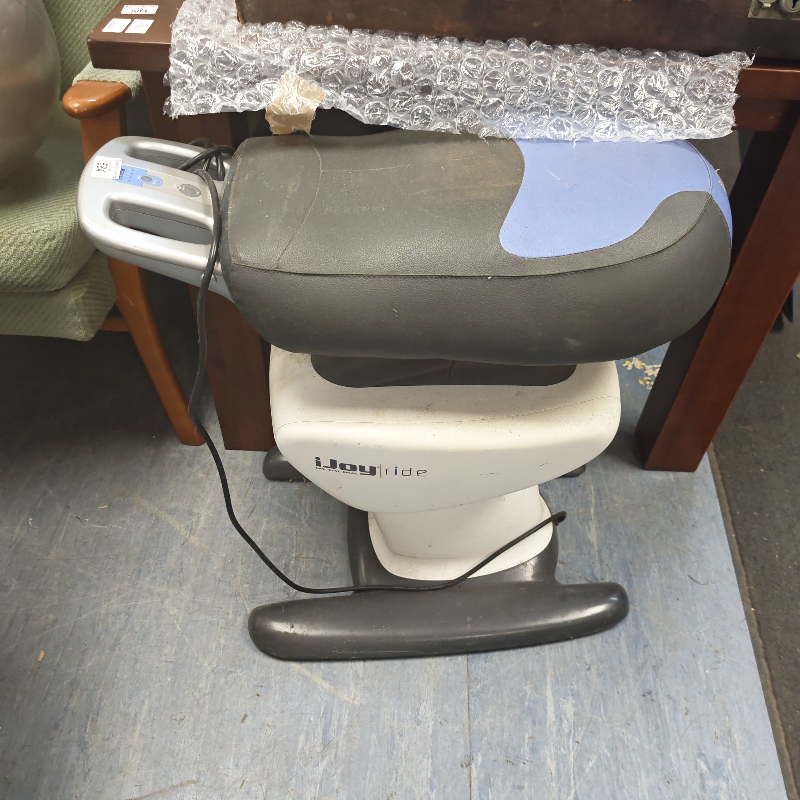 Ijoy Ride horse riding trainer with a worn saddle.