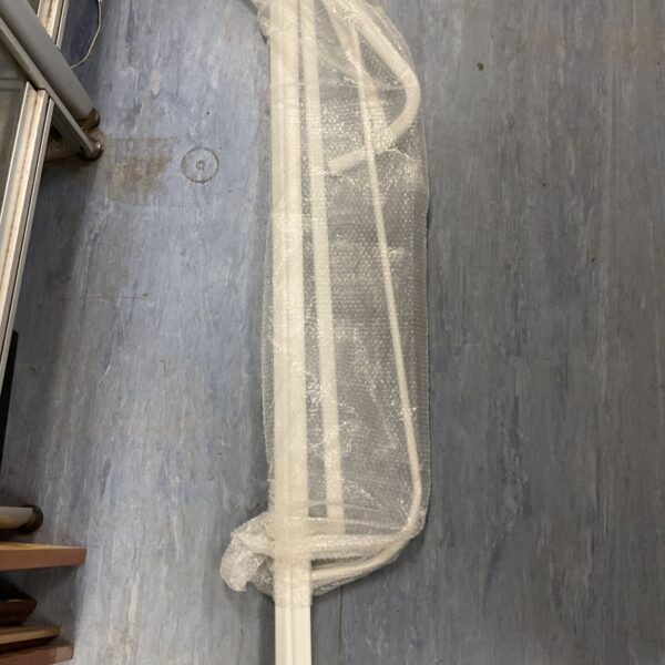 Ikea Mulig clothes rack folded and wrapped in bubble wrap.