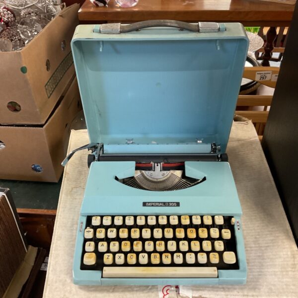 Vintage blue Imperial 200 mechanical typewriter for collectors.
