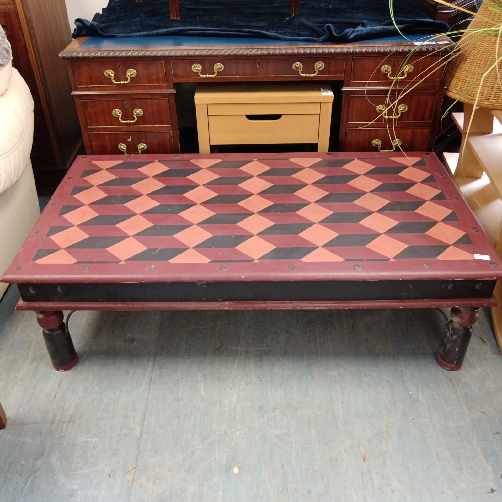 Vibrant Indian oak coffee table with geometric painted design.