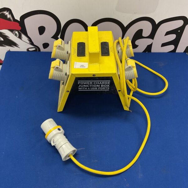 Yellow industrial power distribution box with four outlets.