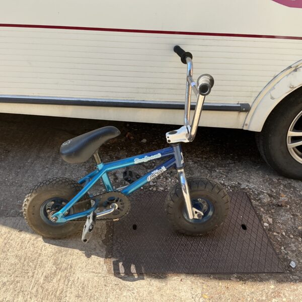 Vibrant seafoam green Irok mini BMX bike for freestyle riding.