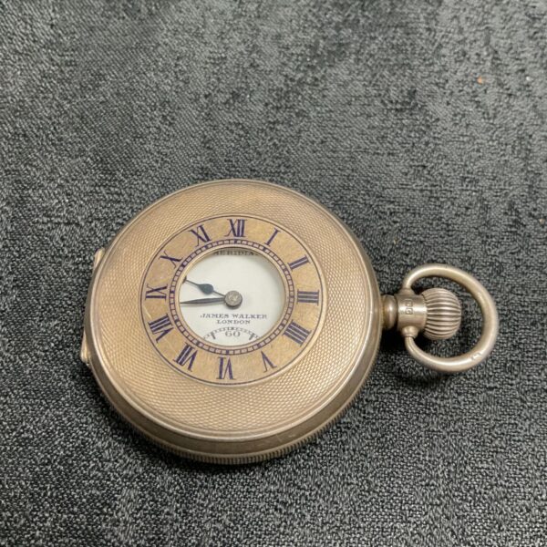 Antique James Walker silver pocket watch with half hunter case.