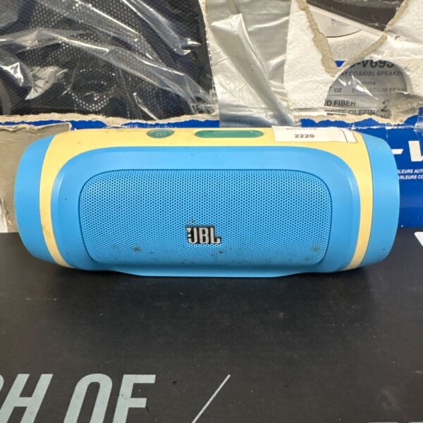 JBL Charge portable Bluetooth speaker showing wear.