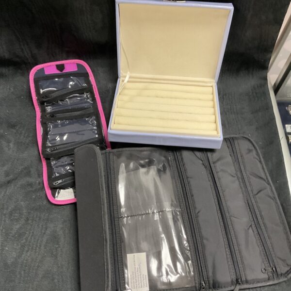 Jewellery storage set with ring box and travel pouches.