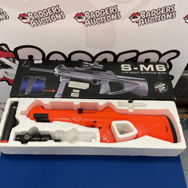 Jia Li Sheng S-M6 airsoft rifle with scope, presented for auction.