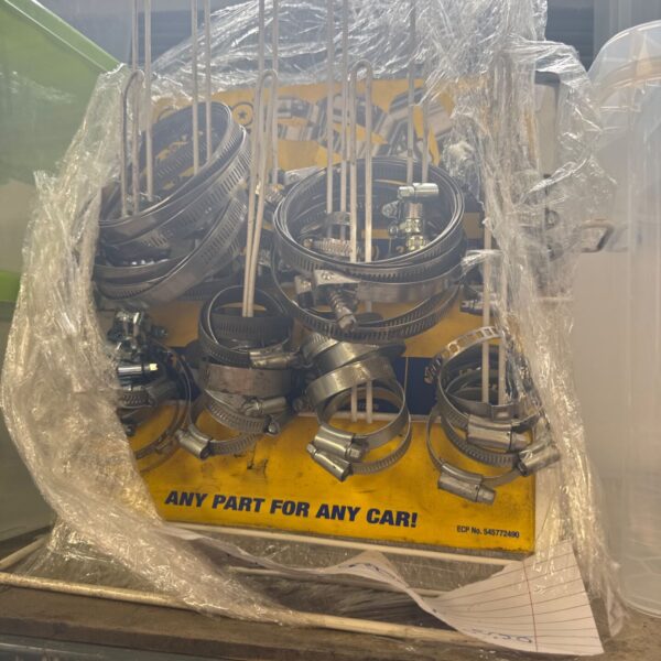 Assorted jubilee clips on a rack for automotive and workshop use.
