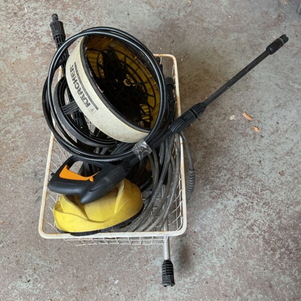 Karcher pressure washer accessories including hose and lance.