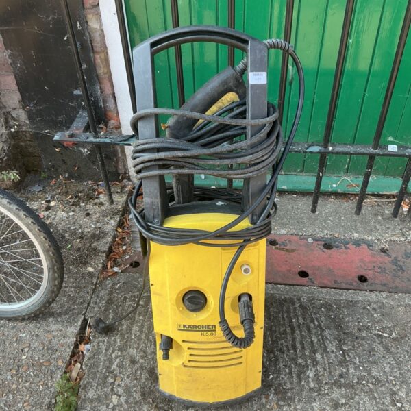 Karcher K5.80 pressure washer with hose and handle.