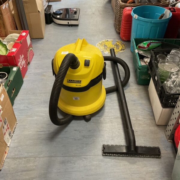 Yellow Kärcher WD 2 Plus wet and dry vacuum cleaner with hose.