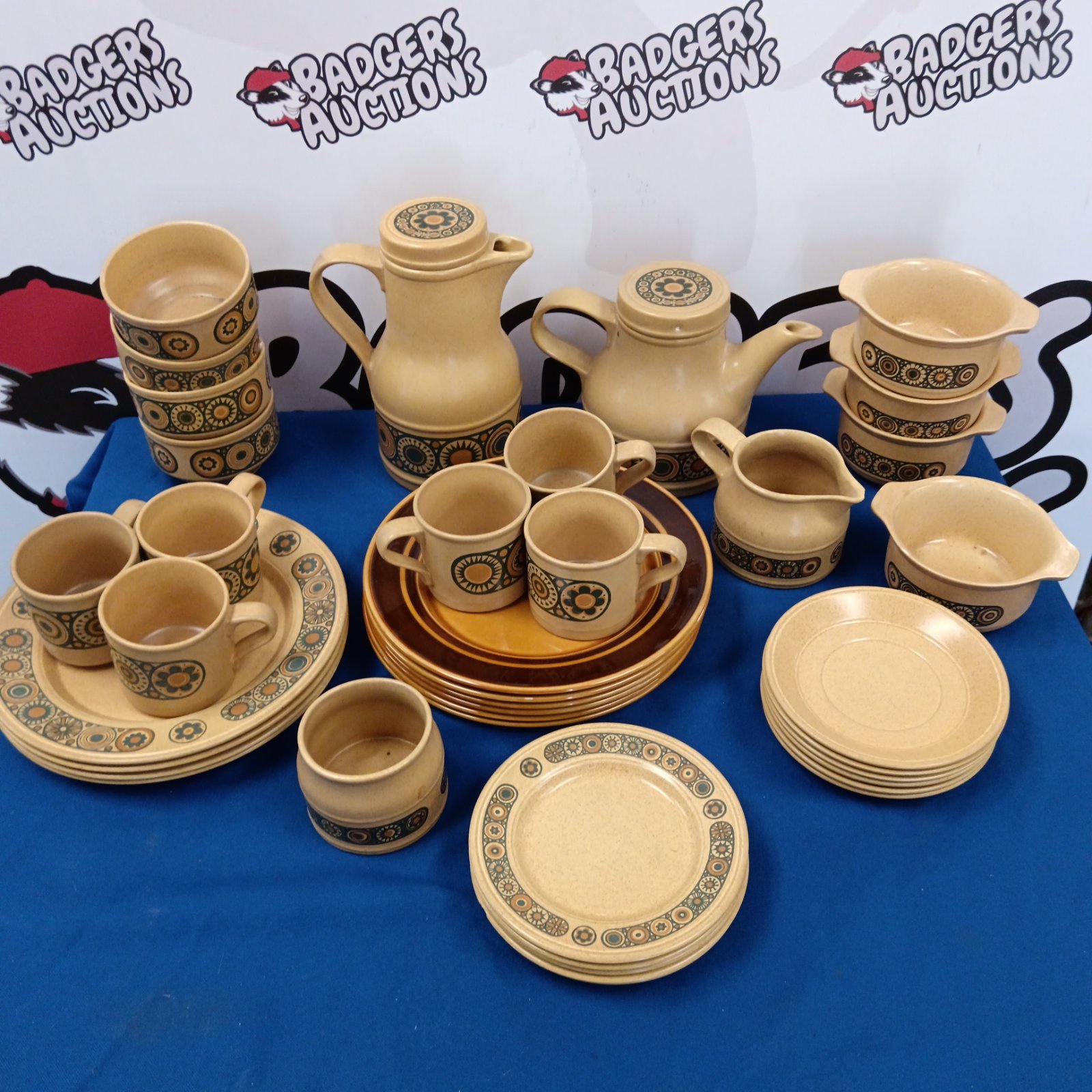 Vintage Kilncraft Bacchus tea set with plates on display.