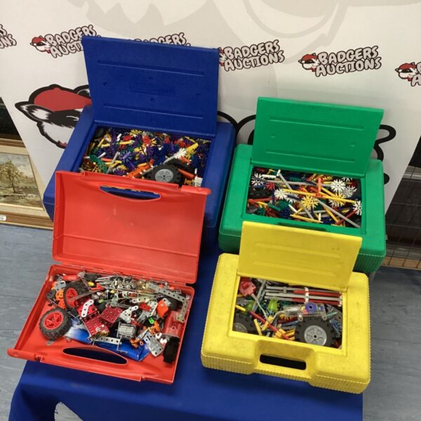 Kinex and Meccano construction toy sets in plastic cases.